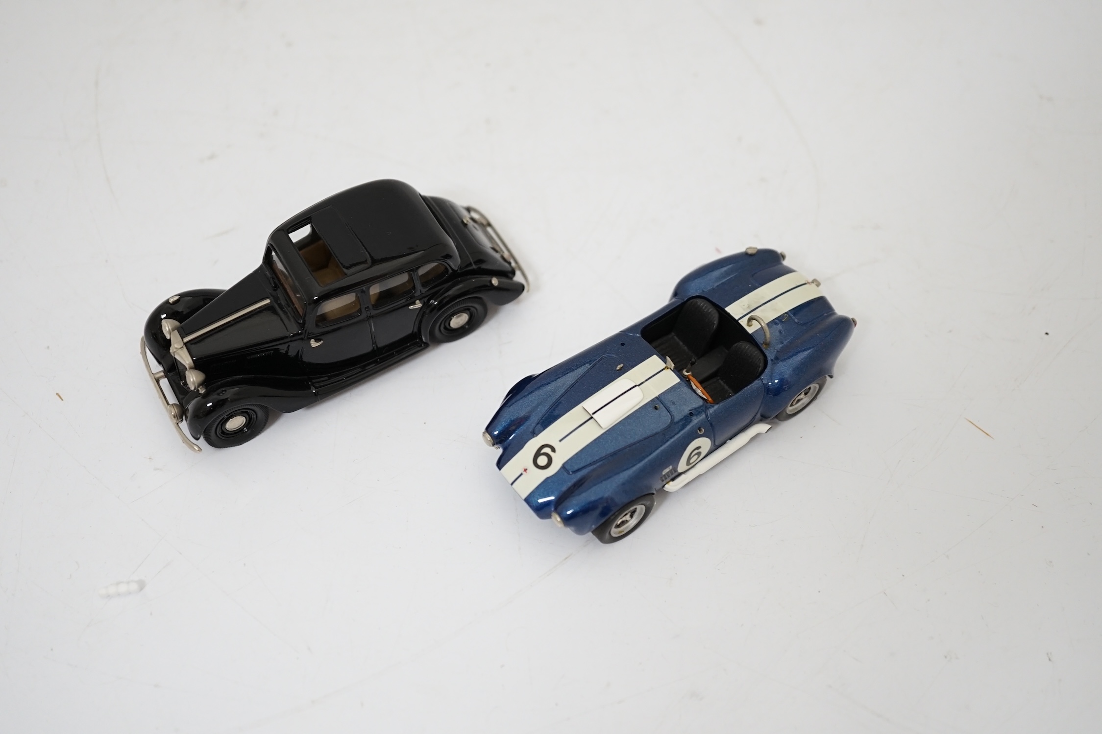 Twenty boxed diecast, white metal, etc. model vehicles including; a Lansdowne Models MG Saloon Type ‘YA’, and an unboxed S.M.T.S. white metal A.C. cobra, two Scalextric cars; a Bentley (C305) and an Alfa-Romeo (C306), th